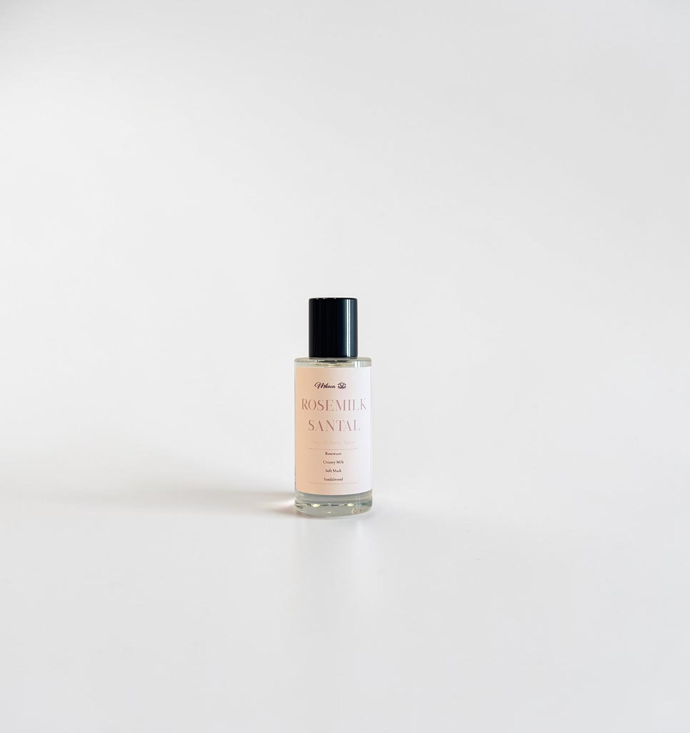 Rosemilk & Santal Fine Fragrance Mist — soft milky rose and warm santal perfume mist photographed on a clean white background.