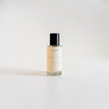 Sienna Haze Fine Fragrance Mist — warm palo santo, creamy vanilla bean, and golden amber scent photographed on a clean white background.