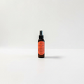 Amber Love Body Oil — bright orange, wild cherry, jasmine, freesia, rose, honeysuckle, sandalwood, and warm musk photographed on a clean white background.
