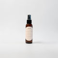 Sienna Haze Body Oil — warm palo santo, creamy vanilla bean, and golden amber photographed on a clean white background.