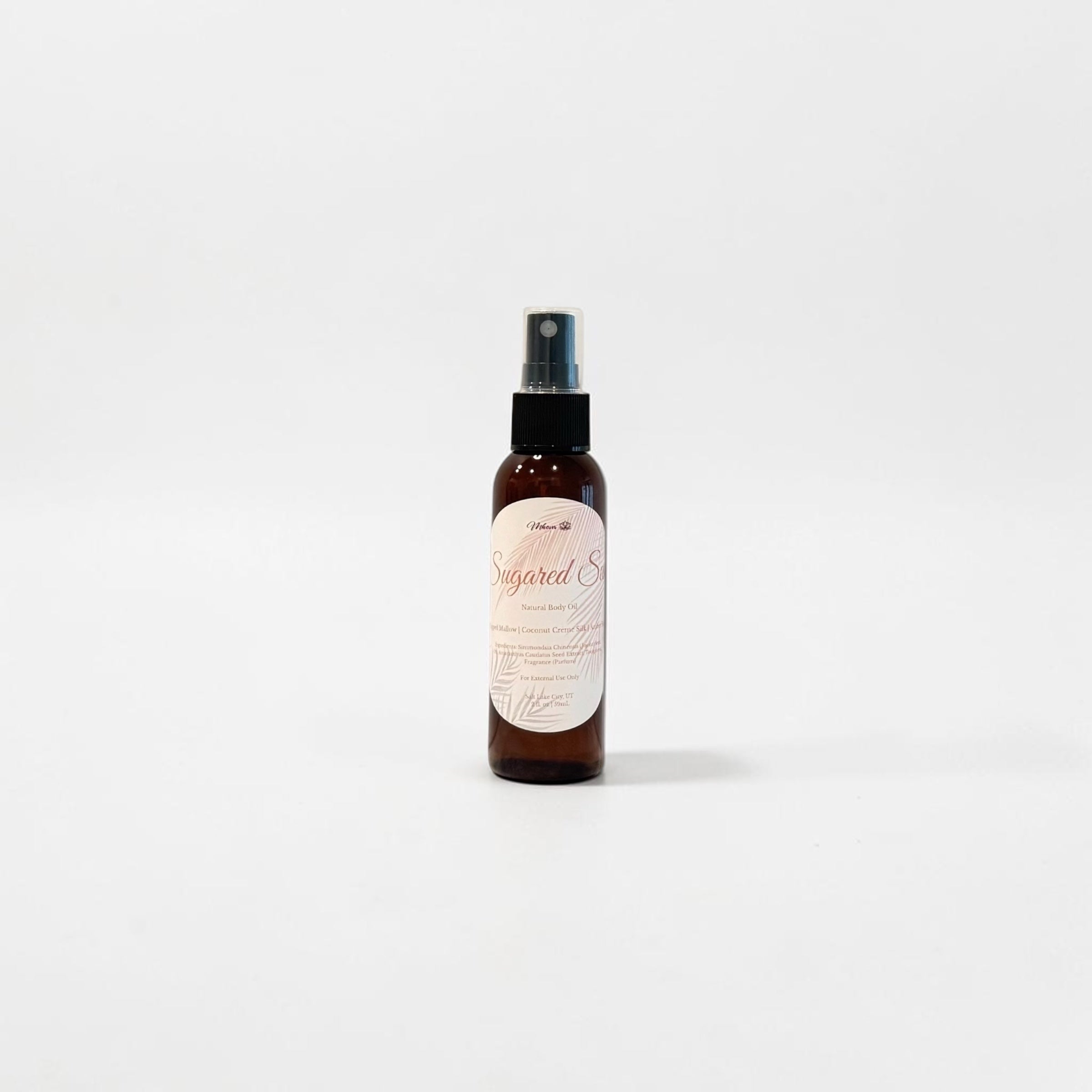 Sugared Sun Body Oil — whipped mallow, amber suede, and coconut silk photographed on a clean white background.