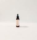 Rosemilk Santal Body Oil — fresh rose, creamy coconut milk, and soft santal woods photographed on a clean white background.