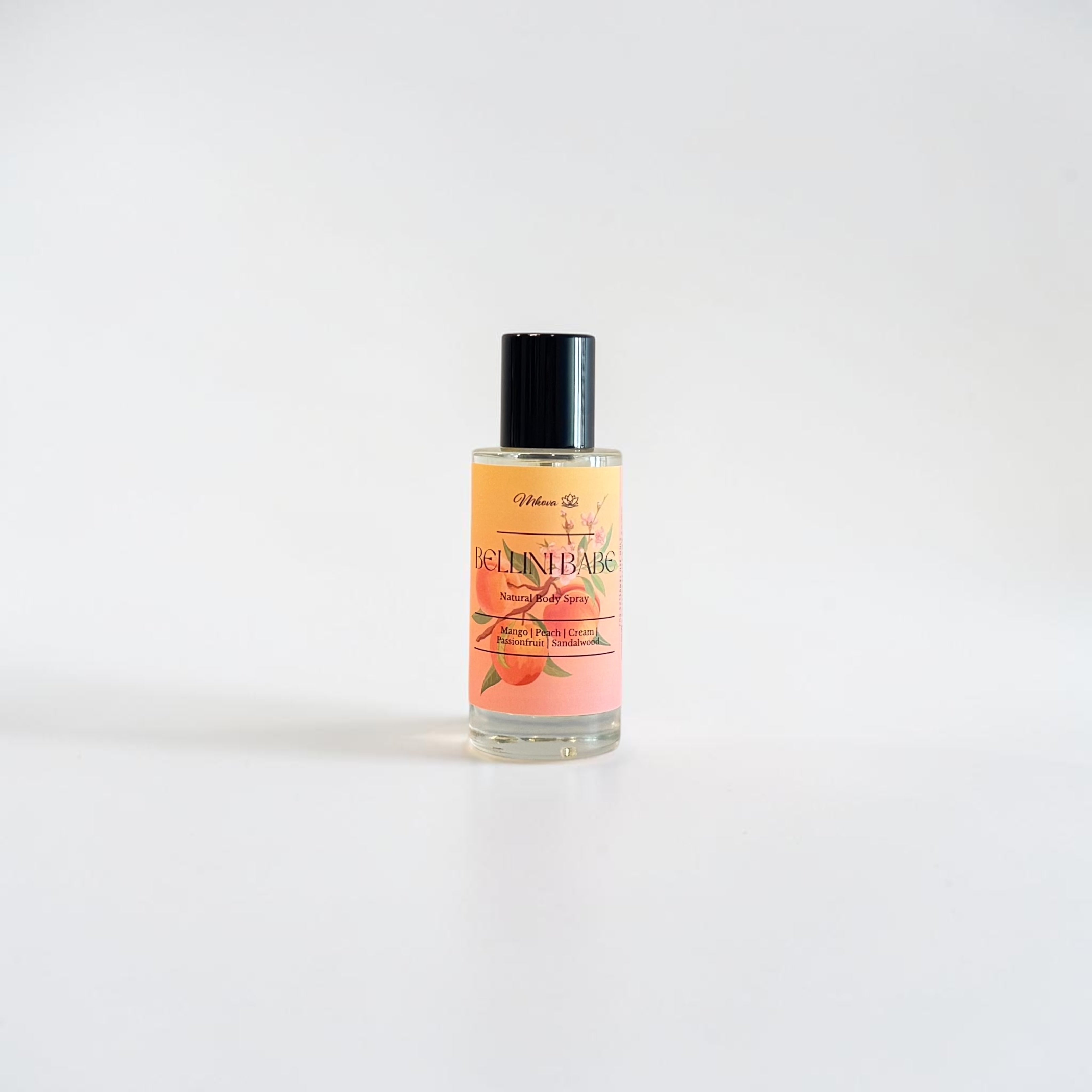Bellini Babe Fine Fragrance Mist — bright mango, peach, cream, and passionfruit scent photographed on a clean white background.