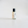Moonflower Bloom Fine Fragrance Mist — bright agave, zesty lemon, and juicy pear opening with cherry blossom, ocean breeze, soft rose, amber, and dark musk photographed on a clean white background.