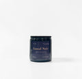 Santal Noir 16oz Candle — black coral, moss, santal, and oud photographed in a moody, luxury setting on a clean white background.